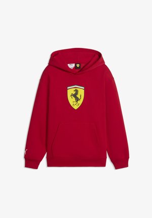 Raudonas džemperis su gaubtu iš medvilnės mišinio, centre - geltonos spalvos skydo logotipas su juodu besiganančiu arkliu, priekine kišene ir raišteliais rankogaliuose.