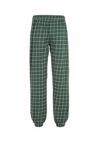 Groene geblokte broek met een elastische tailleband. Bevat een wit rasterpatroon en taps toelopende boorden bij de enkels. Zachte stoftextuur.