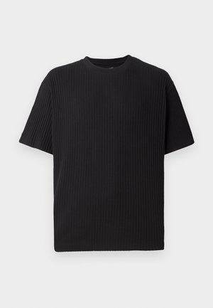 Svart ribbad kortärmad t-shirt med rund halsringning, med en texturerad yta och en avslappnad passform.