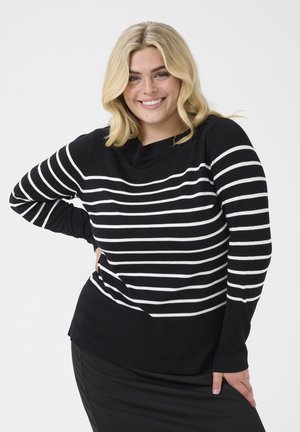 Un pull rayé noir et blanc à manches longues et à coupe décontractée. Tissu texturé avec un large col et un ourlet arrondi.