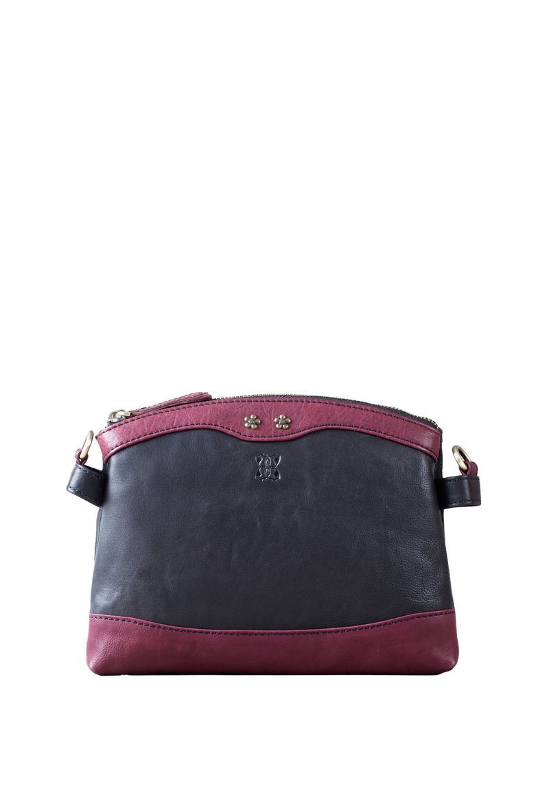 Leather handbag featuring a black body with a burgundy upper section, zip closure, decorative studs, and a detachable strap.