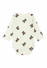 Babybody med lange ærmer i ribstrikket cremefarvet stof med et gentaget mønster af brune bamser. Har trykknapper i bunden.