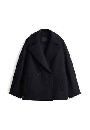 Double-breasted black wool coat with large lapels, two front pockets, and button closures. Soft texture with a structured silhouette.