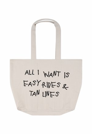 Beżowa torba na ramię z długimi rączkami i czarnym napisem z przodu: „Wszystko, czego chcę, to łatwe przejażdżki i linie opalenizny".