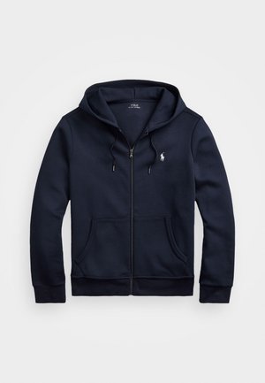 Tmavomodrá zipová mikina vyrobená z jemného materiálu, s kapucňou na šnúrku, prednými vreckami a malým logom na ľavom prsníku.