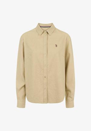 Beige långärmad skjorta med knäppbar krage, med en liten broderad design på vänster bröst och rak fåll.