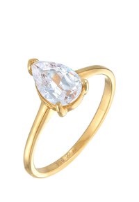 Goldplattierter Ring mit einem großen, klaren, tropfenförmigen Kristall, der in vier Krallen gefasst ist, und einem glatten, polierten Band.
