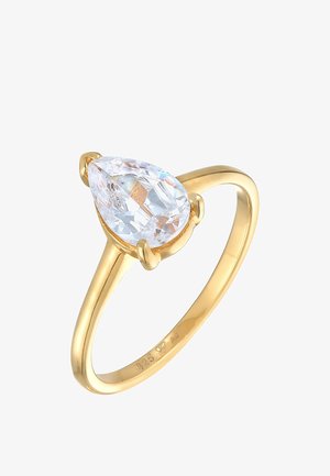 Goldplattierter Ring mit einem großen, klaren, tropfenförmigen Kristall, der in vier Krallen gefasst ist, und einem glatten, polierten Band.