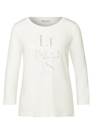 Weißes Langarm-T-Shirt mit rundem Ausschnitt und glänzendem Textdesign, das "LINES" in verschiedenen Schriftarten zeigt. Weicher Stoff.