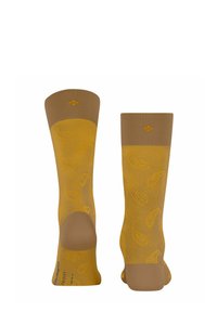 Calzini gialli con motivo, dotati di un bordo marrone a costine e caratterizzati da un design paisley. Realizzati in materiale morbido e leggero.