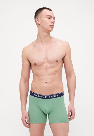 Zelené bavlnené boxerky s námorníckou páskou s logom "POLO RALPH LAUREN". Jednoduchý dizajn, priliehavý strih a hladká textúra.