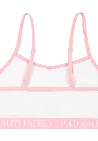 Bralette rose avec bretelles ajustables, tissu blanc et bande logo rose. Texture lisse sans embellissements. Design simple et fonctionnel.