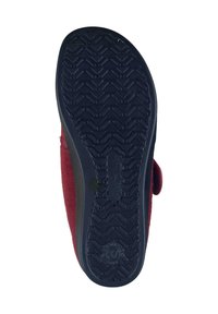 Footwear with a red upper fabric, featuring a textured black rubber sole. The sole has a herringbone pattern for traction.