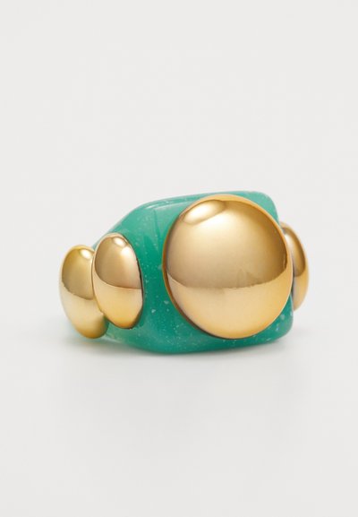 Turquoise resin ring featuring multiple gold-colored spherical accents in varying sizes, smooth texture, and a rounded shape.