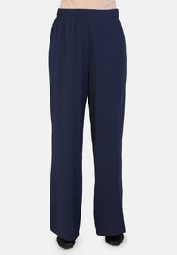 Pantaloni blu navy a gamba larga con elastico in vita, realizzati in un tessuto morbido e testurizzato, caratterizzati da un design loose e rilassato.