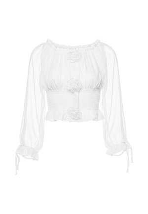 Camicia bianca trasparente a maniche lunghe con elastico in vita, polsini arricciati con lacci e tre decorazioni floreali in tessuto sulla parte anteriore.