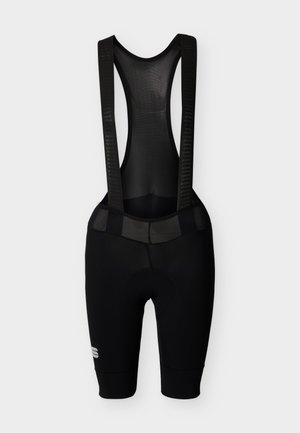 Pantaloncini da ciclismo neri con bretelle in mesh e logo riflettente sulla coscia sinistra, mostrati su uno sfondo chiaro uniforme.