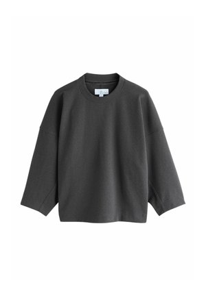 Mørkegrå oversized sweatshirt med rund halsudskæring, sænkede skuldre og lange ærmer, lavet af blødt, tekstureret stof.