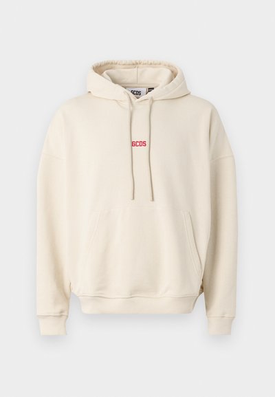 Beige hoodie featuring a drawstring hood, front kangaroo pocket, and red embroidered logo on the chest. Soft material with ribbed cuffs.