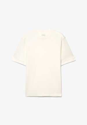 Kurzärmeliges T-Shirt mit Rundhalsausschnitt in Off-White. Baumwollmischgewebe mit glatter Textur, lockere Passform und umgeschlagene Ärmelbündchen. Einfaches Design, ohne Muster.