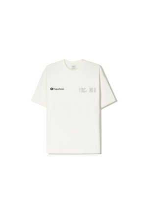 Crème katoenen T-shirt met korte mouwen, voorzien van zwarte tekst en een rasterontwerp aan de linkerkant, ronde halslijn en een losse pasvorm.