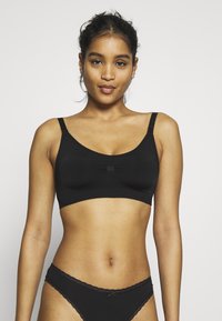 MAGIC Bodyfashion - BETTER THAN SPAGHETTI - T-shirt bra - black Thumbnail Image 1