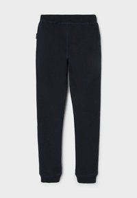 Marineblaue Sweatpants aus weichem Stoff, mit einem elastischen Bund, schmal zulaufenden Beinen und kontrastierenden Nähten entlang der Nähte.