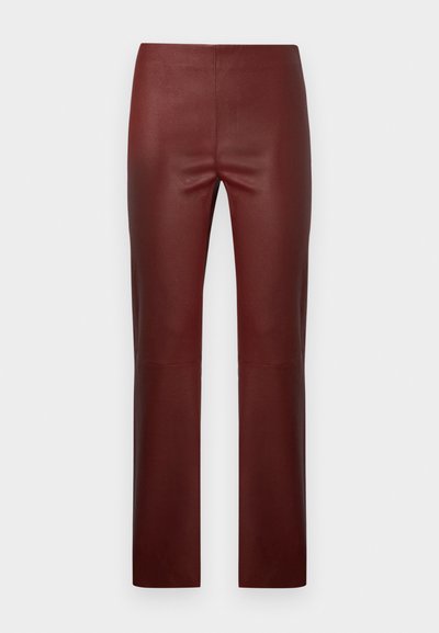 Burgundy faux leather pants with a slim fit, featuring a smooth texture, straight leg design, and no visible hardware or accents.