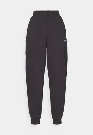 Schwarze Sweatpants aus einem Baumwollgemisch, mit elastischem Bund und Bündchen, sowie einem kleinen weißen Logo auf der linken Hüfte.