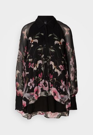 Black floral blouse with long sheer sleeves, featuring pink and green floral patterns, a collared neckline, and a loose, flowing design.