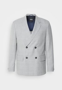 Double-breasted blazer in light gray fabric with a check pattern. Features notch lapels, two front pockets, and black buttons.