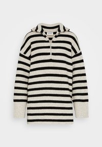 Pull en maille rayé beige et noir avec manches longues, demi-fermeture éclair à l'avant et col, de la marque Monki.