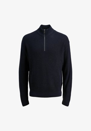 Tamsiai mėlynas megztas džemperis su aukštu apykakle ir užtrauktuku. Turi gumbuotą tekstūrą, ilgus rankovės ir šonines plyšius apvadu.