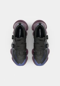 Black and purple athletic shoes with mesh and synthetic upper, featuring adjustable straps, circular closure, and textured sole.