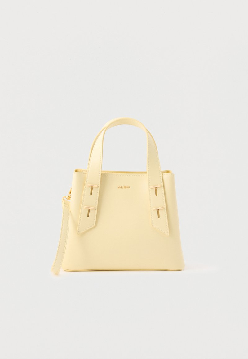 Petit sac à main structuré jaune pâle avec deux poignées supérieures et une tirette de fermeture éclair sur un fond blanc uni.