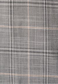 Gray plaid fabric featuring a textured weave. The pattern consists of dark and light gray lines with orange accents, creating a checkered design.