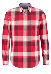 Chemise à carreaux rouge, blanche, grise et rouge foncé, à boutons, manches longues, poche poitrine et un petit logo crocodile vert sur la poche.