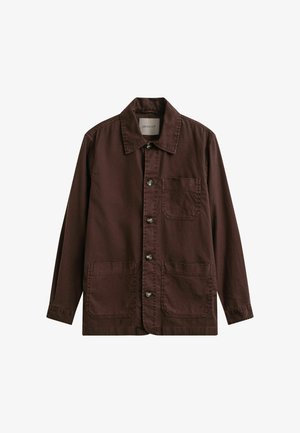 Braune Hemdjacke mit drei Fronttaschen und Kragen, langen Ärmeln und sichtbaren Steppnähten.