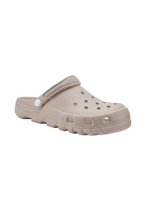 Beige instapklomp met ventilatiegaten, een geribbelde zool en een verstelbare band voor een stevige pasvorm en casual draagcomfort.