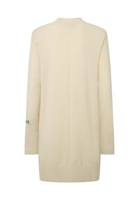 Felpa oversize color crema con maniche lunghe, polsini a coste e texture lavorata a maglia. Dettaglio della cucitura centrale sul retro.