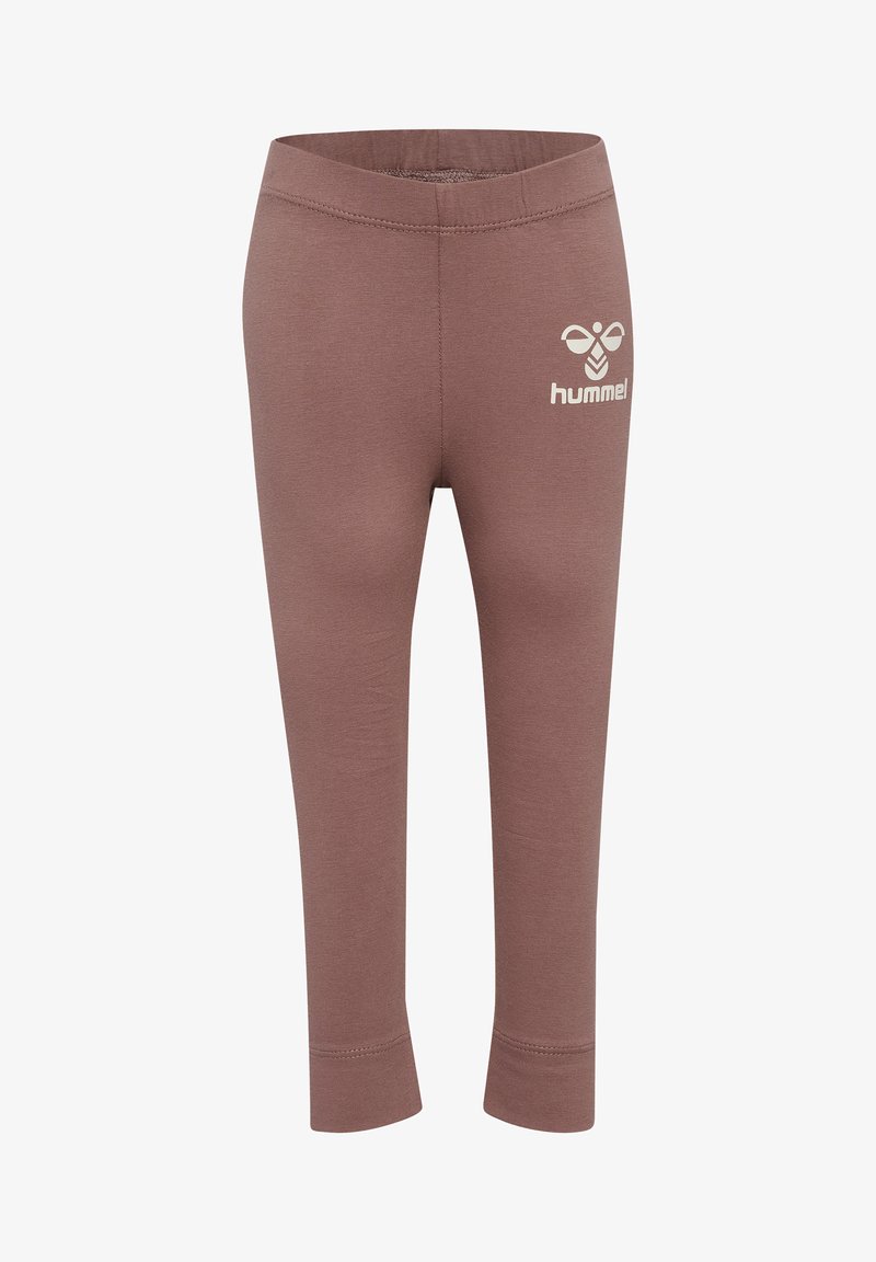 Bruine leggings met een zachte textuur, voorzien van een elastische tailleband en een klein wit logo van "hummel" aan de voorkant.