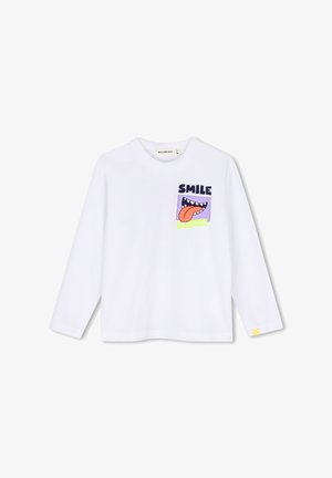 Biała koszula z długim rękawem z kolorową grafiką otwartych ust, wystawionego języka i słowem "SMILE" na piersi.