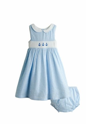Vestito per bambino senza maniche a righe blu e bianche con colletto bianco, ancore blu ricamate sul petto e mutandine abbinate a righe.