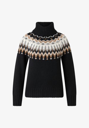 Sort strikket turtleneck trøje med hvid, grå og brun geometrisk mønster omkring skuldrene og brystet.