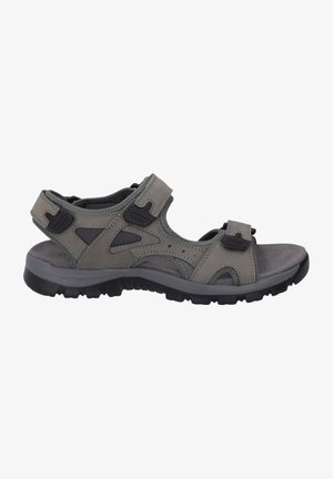 Gray synthetic sandals with adjustable straps, textured insole, and a robust black rubber sole for traction. Lightweight and open design.