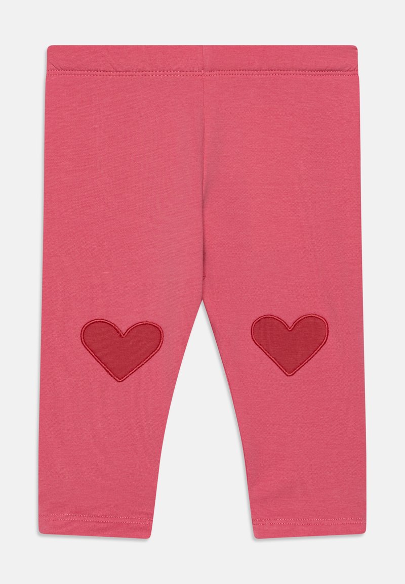 Rozā legingi ar gludu tekstūru, ar sarkaniem sirdspatēliem katrā ceļgalā. Elastīgs jostasvīrs komfortam un piemērotībai.
