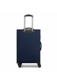 Valigia rigida blu navy con superficie strutturata, manico estraibile e quattro ruote per la mobilità. Maniglia laterale per sollevamento facile.
