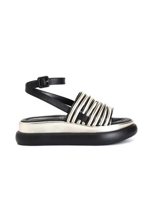 Sandale plateforme noire avec semelle rembourrée dorée métallique et plusieurs brides horizontales dorées et noires sur le pied, bride cheville avec boucle.