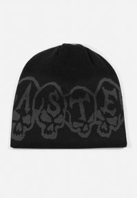 Bonnet en tricot noir avec un design de crâne gris et des lettres. Le tissu en tricot est lisse, présentant une forme ajustée et des coutures minimales.
