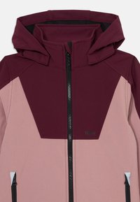 Jacket featuring a maroon upper section, light pink lower section, full zip closure, and two zippered pockets. Fabric has a smooth texture.